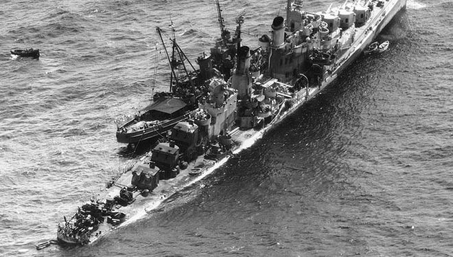 The USS Zuni towing the torpedoed USS Reno 1,500 miles to safety across the war-torn Pacific Ocean from the Philippines to the U.S.-controlled Ulithi atoll in November 1944. The Reno was so badly damaged that the Zuni had to stabilize it to prevent capsizing. The Zuni was renamed the Tamaroa when the Coast Guard took it over after World War II.