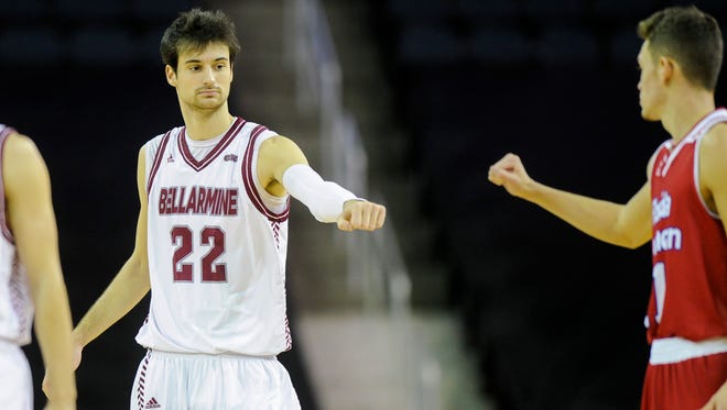 Bellarmine forward Adam Eberhard (22) fist bumps Florida Southern guard Brett Hanson (11) during the Small College Basketball Hall of Fame Classic at the Ford Center in Evansville, Saturday, Nov. 19, 2016. 