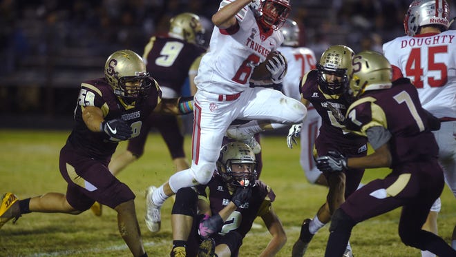 Truckee's Cole Eichele (6) runs over the Sparks defense during their football game in Sparks on Oct. 6.