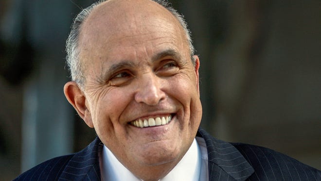 Former New York City Mayor Rudy Giuliani speaks at a press conference in 2014.