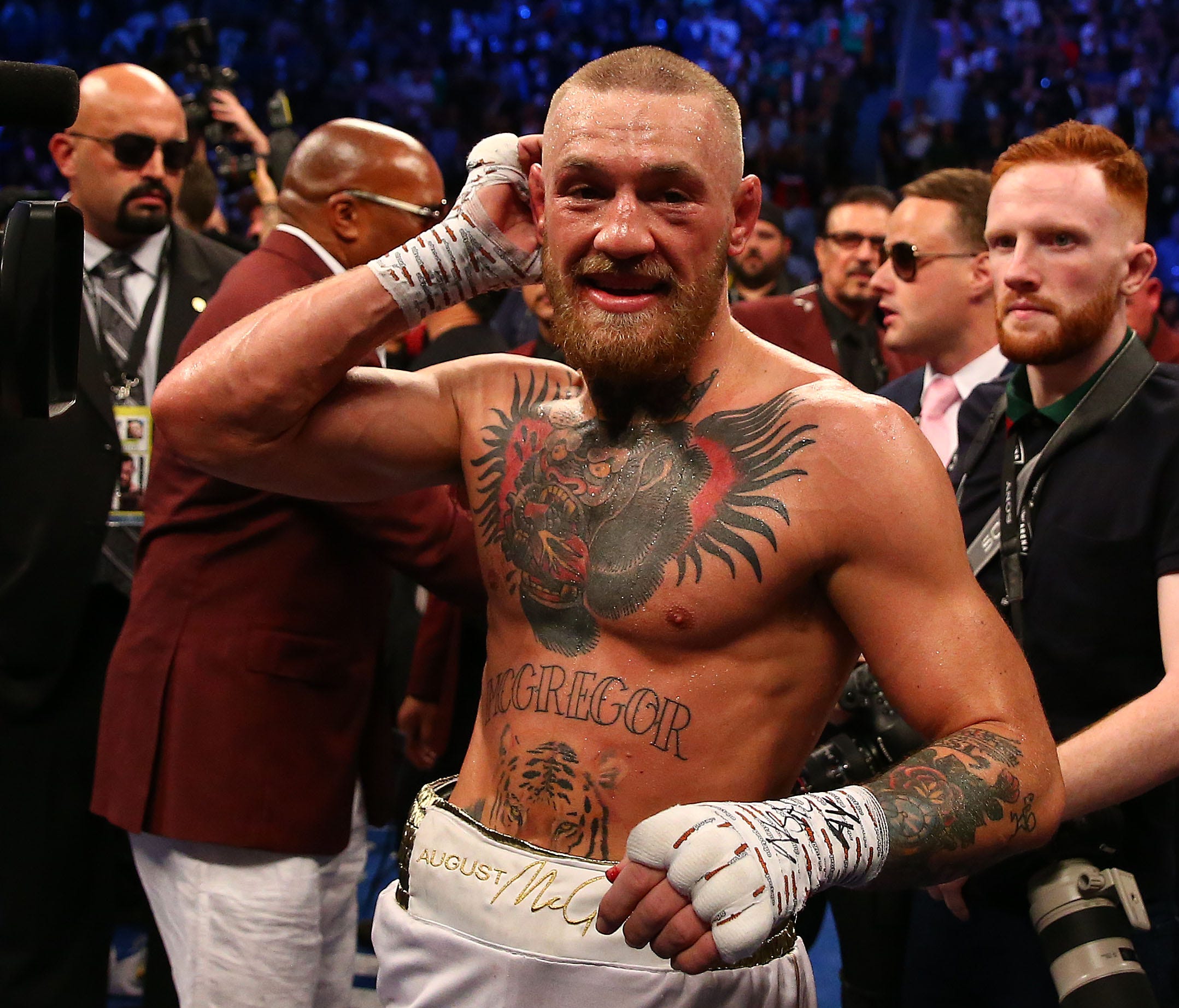 Conor McGregor reacts following his loss against Floyd Mayweather.