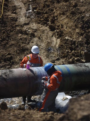 A TransCanada crew works April 8, 2016, at the site of an oil pipeline leak near Freeman, S.D.