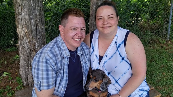 Jesse Vroegh, left, and his wife, Jackie, pose...