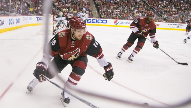 Coyotes' Max Domi (16) and Anthony Duclair (10) play against the Wild at Gila River Arena in Glendale, AZ  on October 15, 2015.