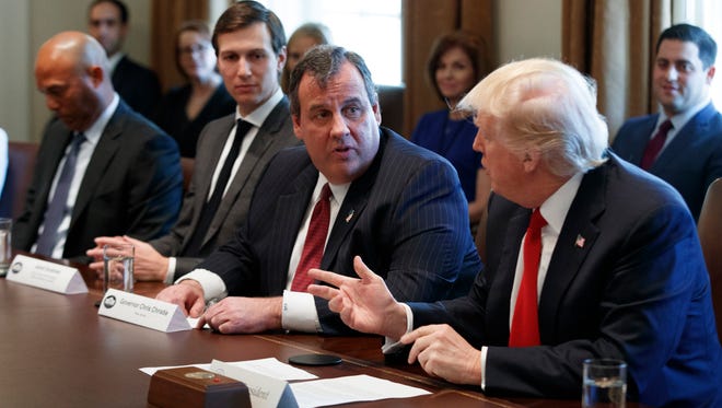 President Donald Trump speaks to Gov. Chris Christie and others during an opioid and drug abuse listening session in March in the Cabinet Room of the White House.