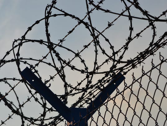 Fence with barbed wire