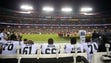 Oakland Raiders players sit on the bench during the