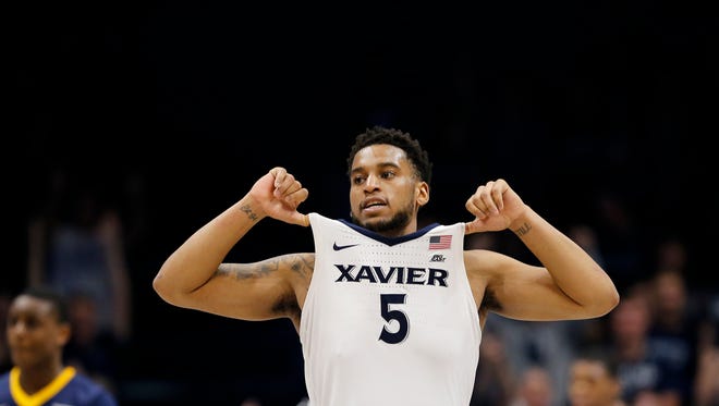 Xavier Musketeers guard Trevon Bluiett (5) celebrates after time expires in the second half of the NCAA basketball game between the Xavier Musketeers and the East Tennessee State Buccaneers at the Cintas Center in Cincinnati on Saturday, Dec. 16, 2017. The Musketeers fought back from a deep deficit in the second half to win 68-66. 