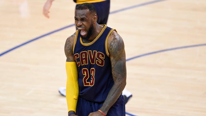 Cleveland Cavaliers forward LeBron James (23) reacts during the 95-93 victory against the Golden State Warriors in game two of the NBA Finals at Oracle Arena