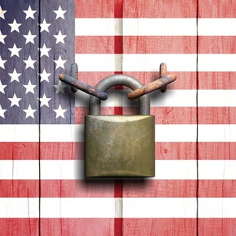 U.S. flag with a padlock keeping it shut.