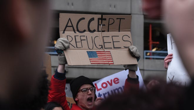 Protesters rally during a demonstration against the immigration ban at John F. Kennedy International Airport on Jan. 28, 2017 in New York City.