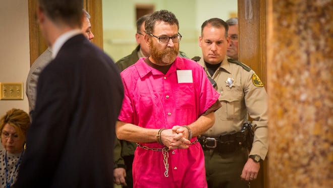 Scott Michael Greene, 46, is led into a Polk County courtroom Thursday for a pretrial hearing. Greene is facing two first-degree murder charges in the Nov. 2 shooting deaths of Urbandale Police Officer Justin Martin and Des Moines Police Sgt. Anthony Beminio.