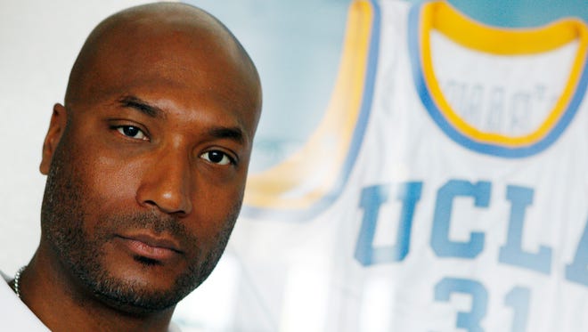 In this Sept. 18, 2010 photo, former UCLA basketball player Ed O'Bannon Jr. sits in his office in Henderson, Nev.