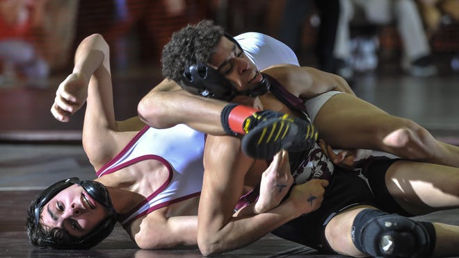 Voorhees’ Aiden Taylor (left) and Xavier Pena of North Plainfield wrestle in their 106-pound bout at Friday’s Region IV wrestling quarterfinals at Union High School.