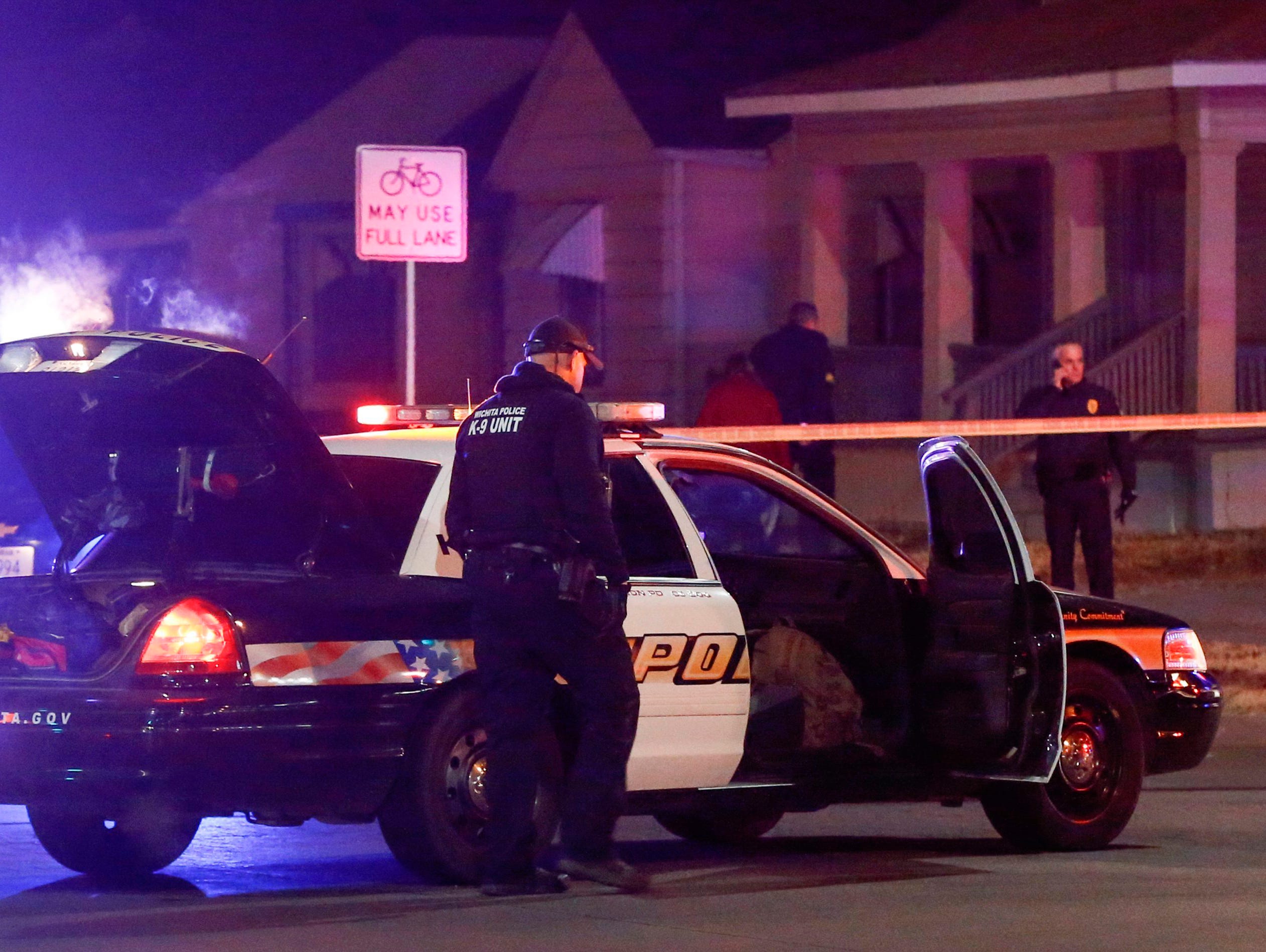 Wichita police investigate a call of a possible hostage situation near the corner of McCormick and Seneca in Wichita, Kan., Thursday night. A man was fatally shot by a police officer in what is believed to be a gaming prank called 