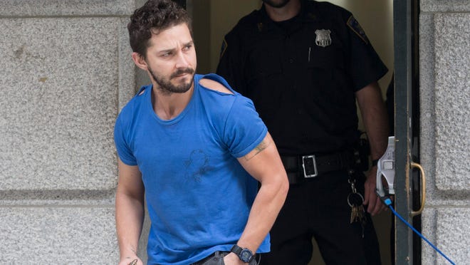 
Actor Shia LaBeouf leaves Midtown Community Court after being arrested the previous day for yelling obscenities at the Broadway show "Cabaret," Friday, June 27, 2014, in New York. The 28-year-old star of the "Transformers" franchise faces charges that include disorderly conduct and criminal trespass.
