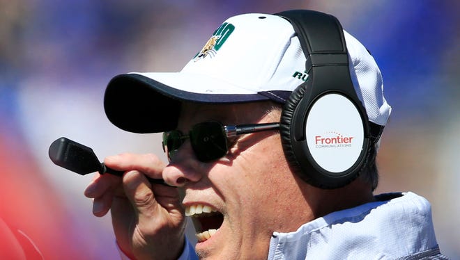 Ohio coach Frank Solich yells to his players during the first half Saturday against Kansas.