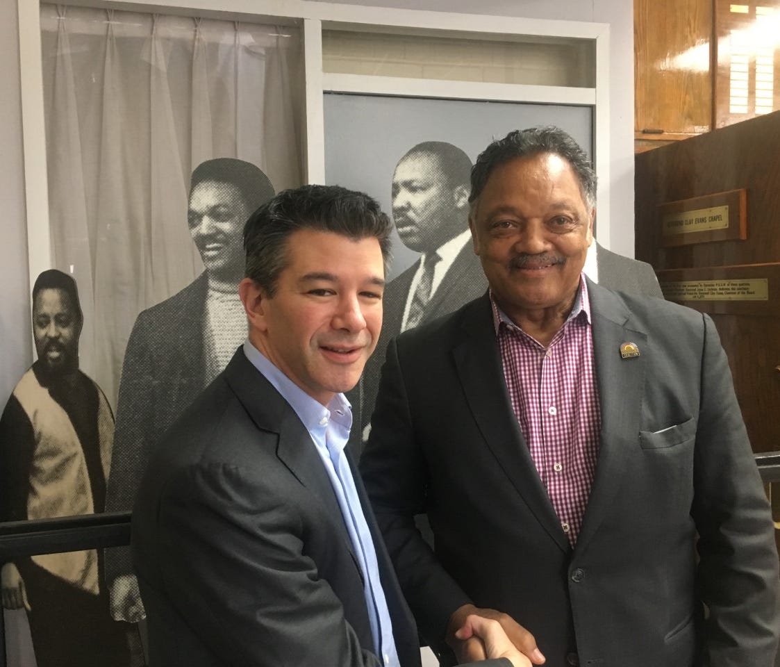 Uber CEO Travis Kalanick (l) and Jesse Jackson of the Rainbow PUSH Coalition (r) at the organization's headquarters in Chicago on March 23, 2017.