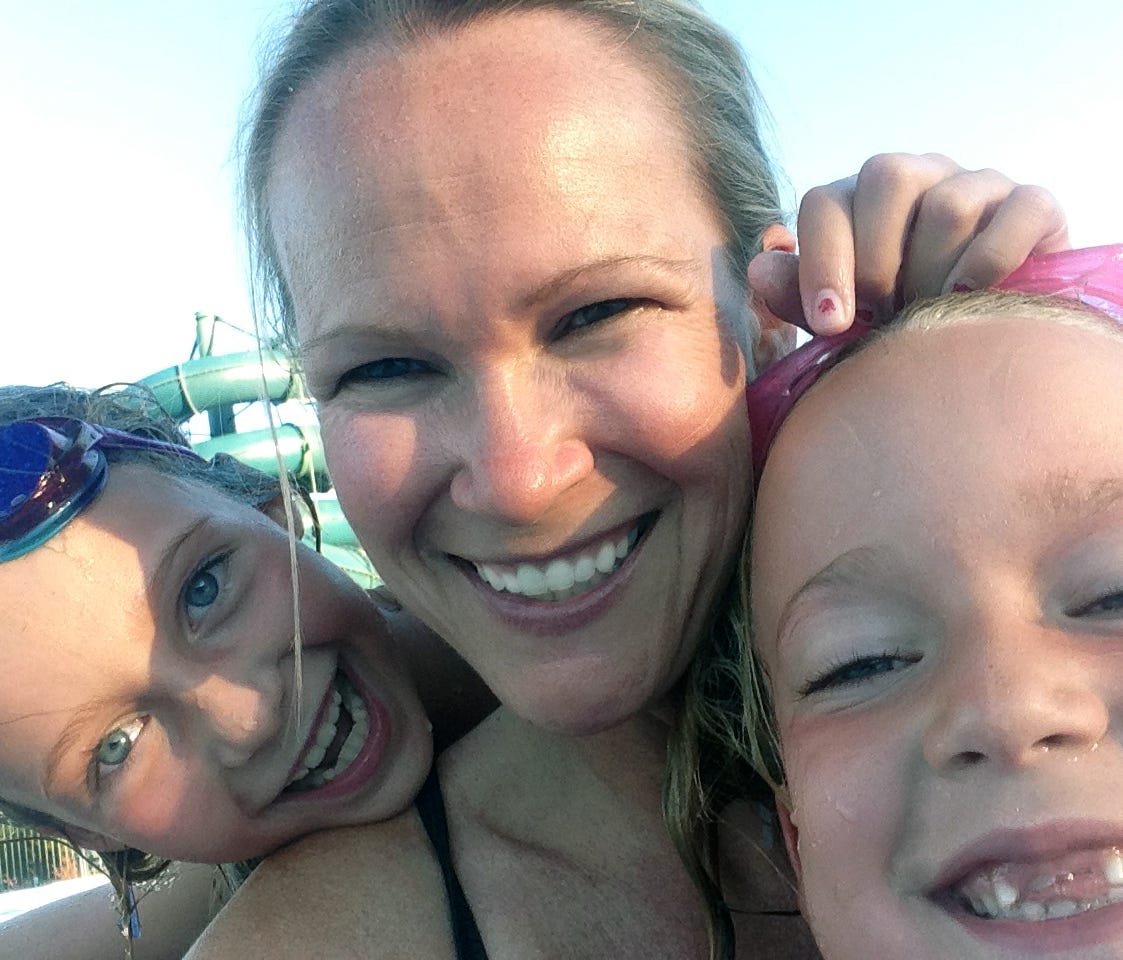 Patty Triplet West and her daughters in the pool for a tight Selfie shot.