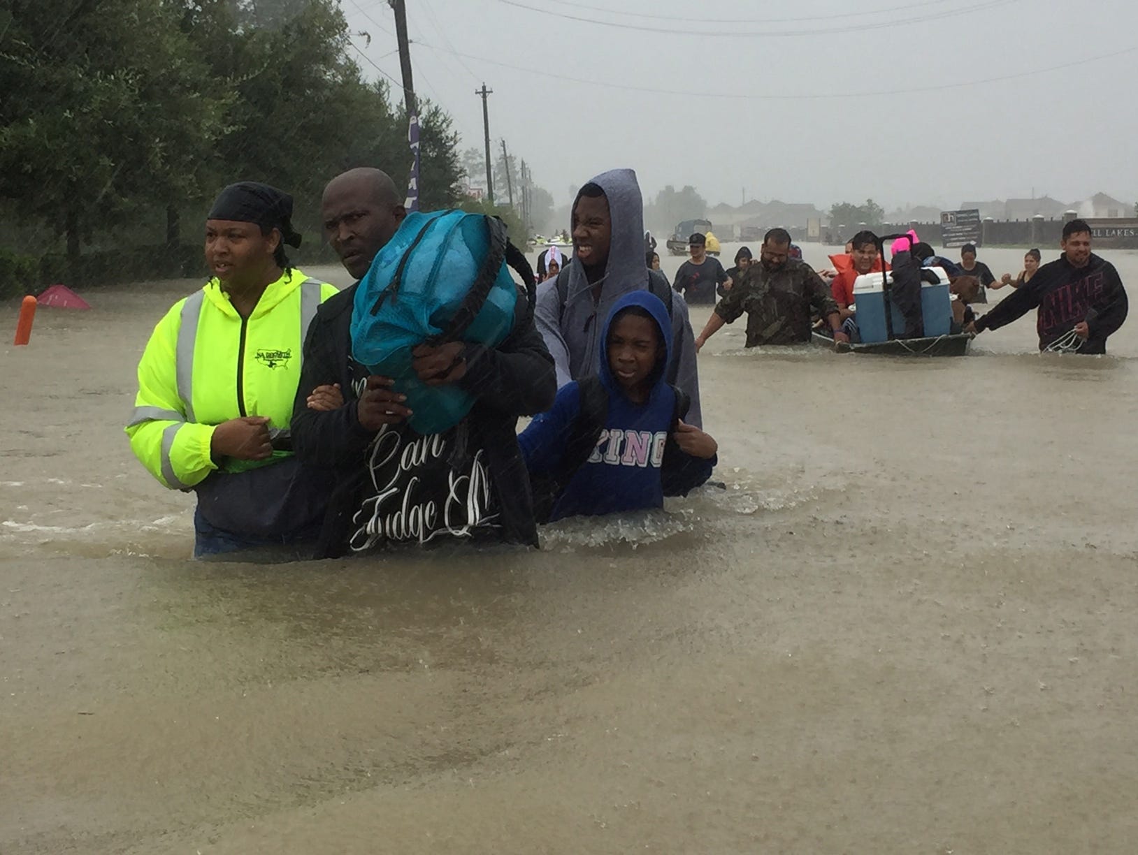 Volunteer rescue residents from flooding from Tropical Storm Harvey.