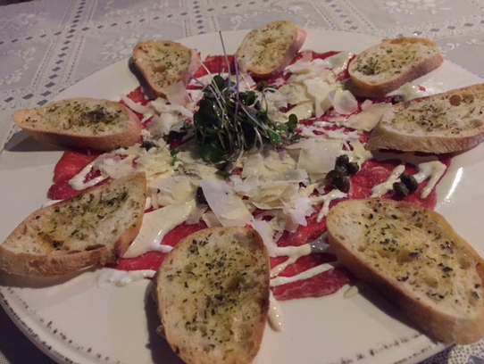 Merelli's Italian Cuisine serves an appetizer of carpaccio.