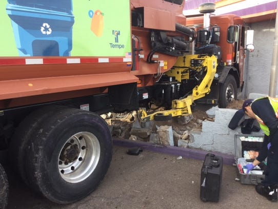 A city of Tempe garbage truck hit four cars at Seventh