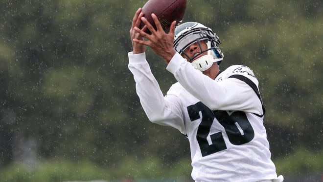 Jul 26, 2014; Philadelphia, PA, USA; Philadelphia Eagles cornerback Cary Williams (26) catches the ball during training camp at the Novacare Complex in Philadelphia PA. Mandatory Credit: Bill Streicher-USA TODAY Sports