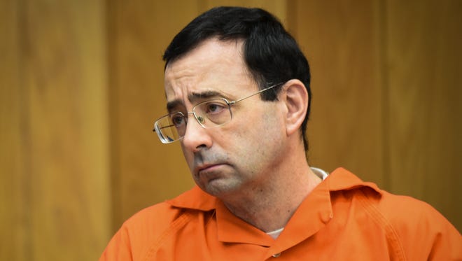 Larry Nassar listens to 17-year-old Jessica Thomashow's victim impact statement Wednesday, Jan. 31, 2018, during the first day of victim impact statements in Eaton County Circuit Court in Charlotte, Mich., where Nassar is expected to be sentenced on three counts of sexual assault some time next week.