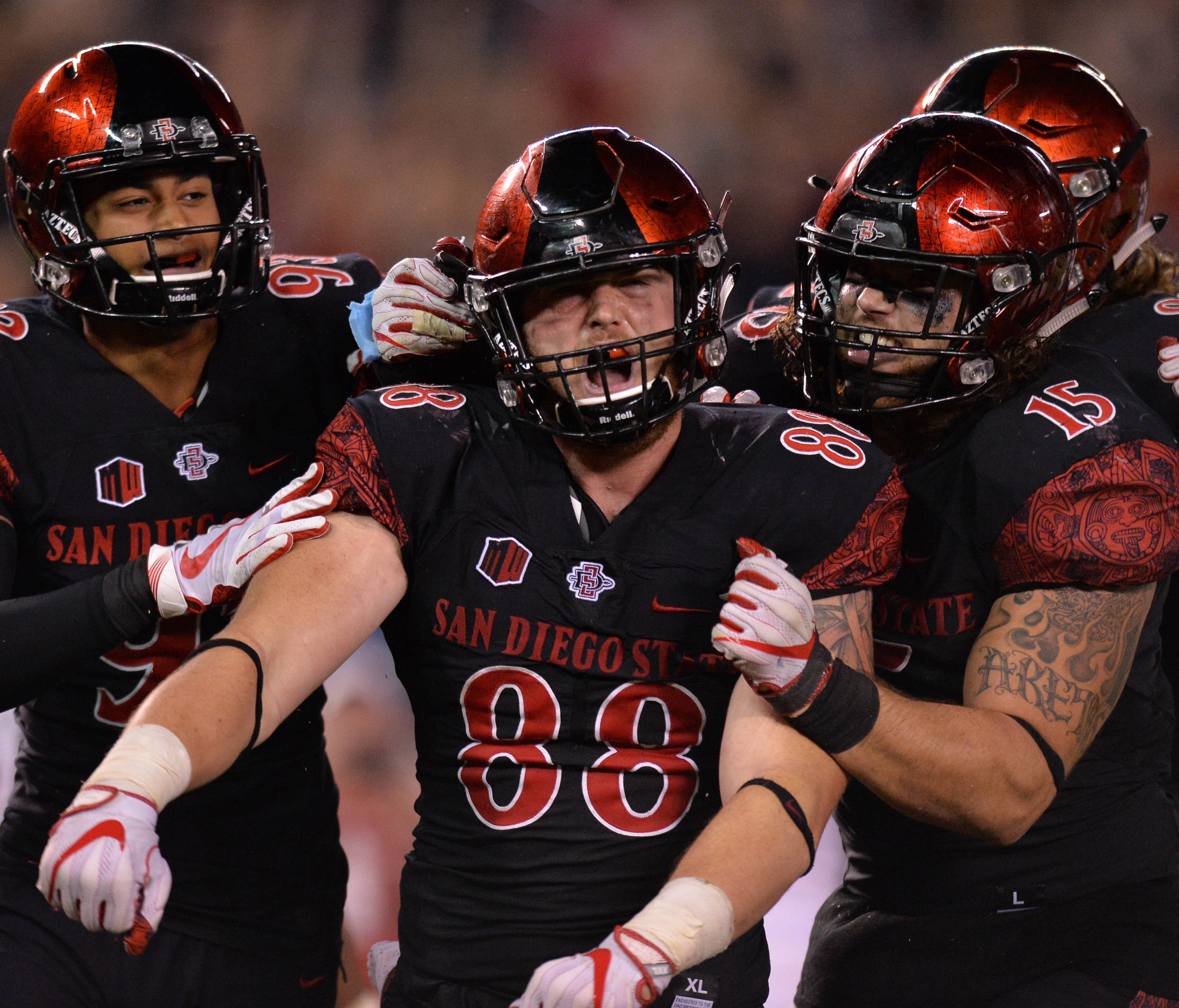 San Diego State tight end David Wells celebrates with teammates after scoring the game-winning touchdown during the fourth quarter against Stanford.