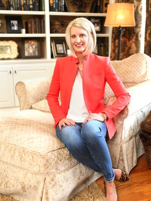 Stylemaker Julia Bacon in her reddish orange blazer with a white shirt and jeans in the living room of her home in Crestwood. Feb. 24, 2016