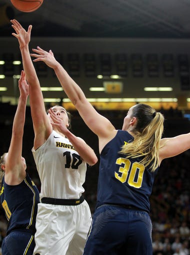 Iowa's Megan Gustafson takes a shot during the Hawkeyes'