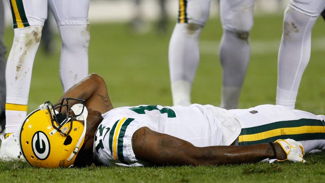 Green Bay Packers' Davante Adams lays on the field after being hit in the head during the second half of an NFL football game against the Chicago Bears Thursday, Sept. 28, 2017, in Green Bay, Wis. Adams left the game on a stretcher. (AP Photo/Matt Ludtke)