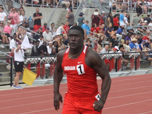 Indian Hill's Dimetrius Baylor sprints in the 100 meter
