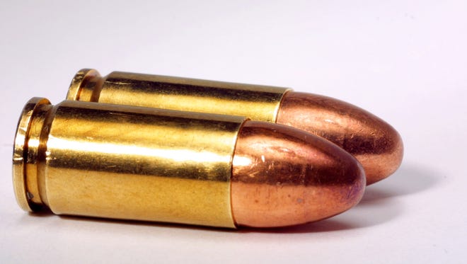 Two 9mm bullets for a handgun.
