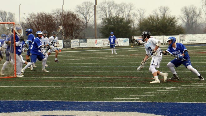 Loyola's Thomas Wiener attacks the Jesuit goal during Sunday's action at Messmer Stadium.
