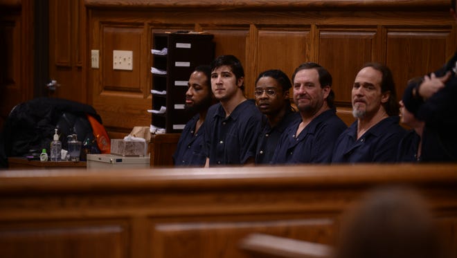 Charlie Pittman, second from left, appears in Madison County Circuit Court on Monday.