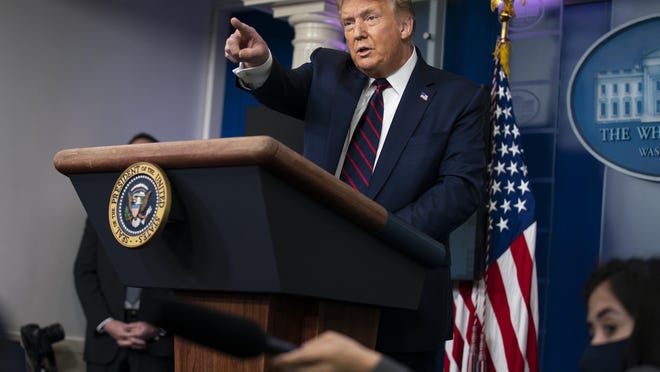 President Donald Trump speaks during a news conference at the White House on Tuesday evening in Washington.