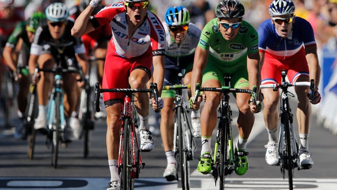 
Norway’s Alexander Kristoff, left, finishes ahead of Slovakia’s Peter Sagan, center, and France’s Arnaud Demare to win stage 12 of the Tour de France.
