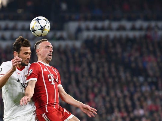 Bayern's Franck Ribery, right, and Sevilla's Franco Damian Vazquez go for a header during the Champions League quarter final second leg soccer match between FC Bayern Munich and Sevilla FC at the Allianz Arena stadium in Munich, Germany, Wednesday, April 11, 2018. (Sven Hoppe/dpa via AP)