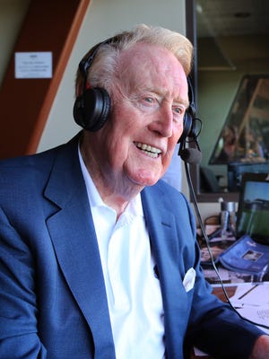 Legendary broadcaster Vin Scully sits in the booth at the Los Angeles Dodgers' Camelback Ranch Spring Training complex in Glendale, Arizona on March 25, 2016, during his last broadcast there.