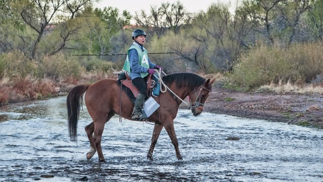Colorado rider Betty Garrett crosses the Mimbres River during the recent competitive trail ride held at NAN Ranch.