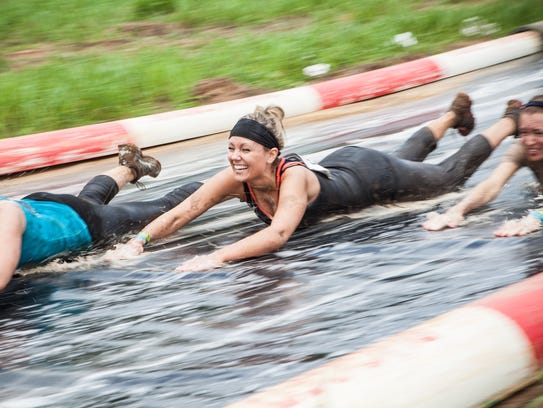 A 60-foot water slide is among the 25 obstacles at