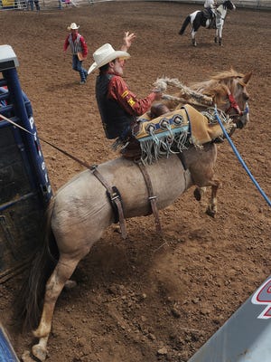 Reed Neely leaves the bucking chute at an earlier Ventura County Fair PRCA Rodeo.