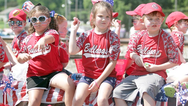 Kids throw candy to the crowd at the 4th of July parade in Pegram, TN 2018.