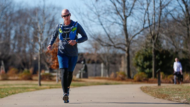 Springfield Police Department homicide detective Matt Farmer runs on the South Creek Greenway on Wednesday, Dec. 6, 2017. Farmer has been training for the Snowdrop 55-hour Ultra Race and RelayÊon Dec. 30 in Missouri City, Texas. He is running in honor of his friend Joey Benjamin, a Willard 10-year-old who recently beatÊa rare form ofÊcancer.