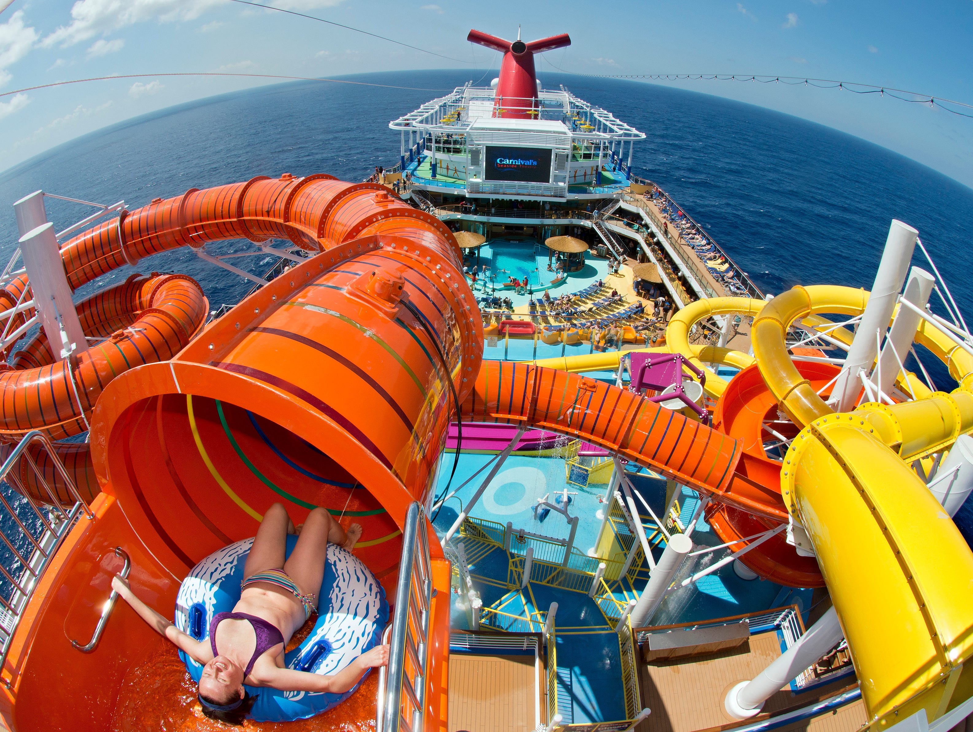The orange Kaleid-O-Slide is part of the WaterWorks fun zone atop cruise giant Carnival's new Carnival Vista.