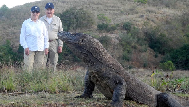 Glenna Buehler of Fraser and Ludwik Labaj of Romeo took the D to Komodo Island, part of the Lesser Sunda chain of Indonesian islands in August of 2015. They are in Komodo National Park with a park guide looking at a Komodo dragon. Picture received Dec. 2015 for Travel with the D.