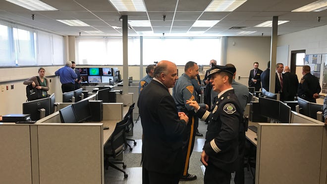 Sen. Stephen Sweeney (left) talks with Camden County Police Chief Scott Thomson at the unveiling of the NJ State Police Real Time Crime Center at Rowan College at Gloucester County.