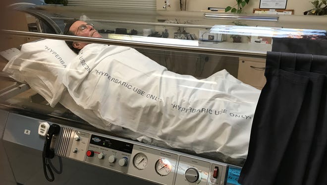 Bob Liebman relaxes comfortably in the hyperbaric oxygen chamber at Desert Hyperbaric Medicine as the high-pressure oxygen speeds up his normal healing process.