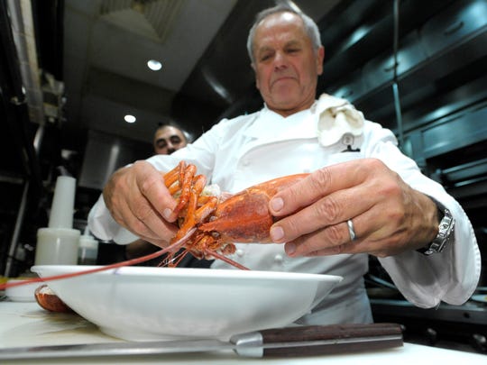 Wolfgang Puck breaks up a Lobster for Lobster Pasta. The World renowned master chef was promoting his restaurant inside MGM Grand Detroit called, “Wolfgang Puck Steak." He gave a cooking class to area food reporters and food bloggers Friday, Nov. 6, 2015.